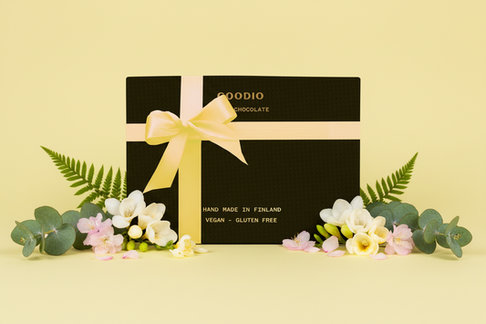 Goodio chocolate box with a yellow ribbon on a white background