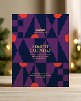 Load image into Gallery viewer, A purple-colored Goodio advent calendar with vegan organic chocolate flavors
